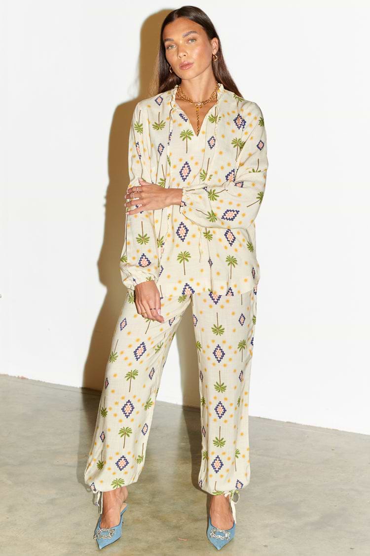 Model wearing Cream St Tropez Trousers