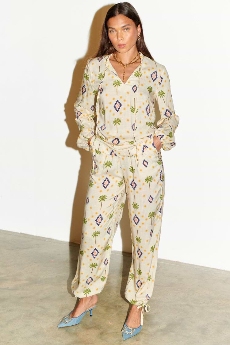 Model wearing Cream St Tropez Trousers