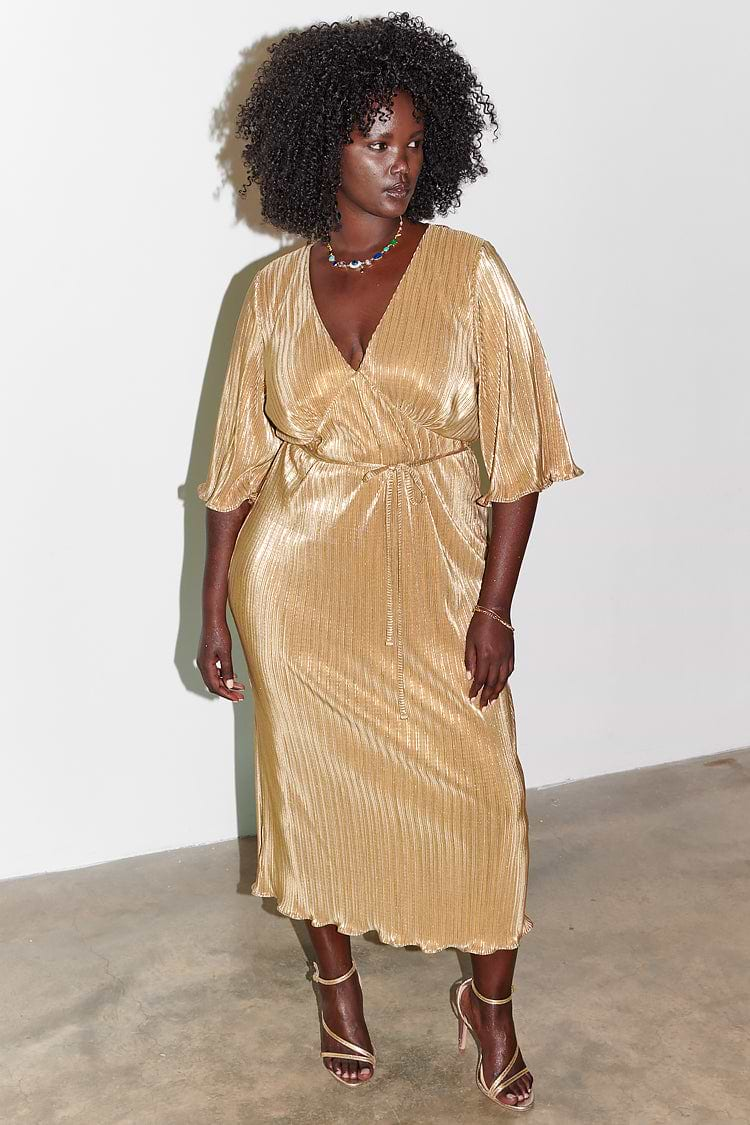 Model wearing gold plisse dress