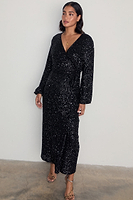 Thumbnail for caption_Model wears Black Sequin Kira Wrap Dress in UK size 10/ US 6