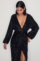 Thumbnail for caption_Model wears Black Sequin Kira Wrap Dress in UK size 10/ US 6