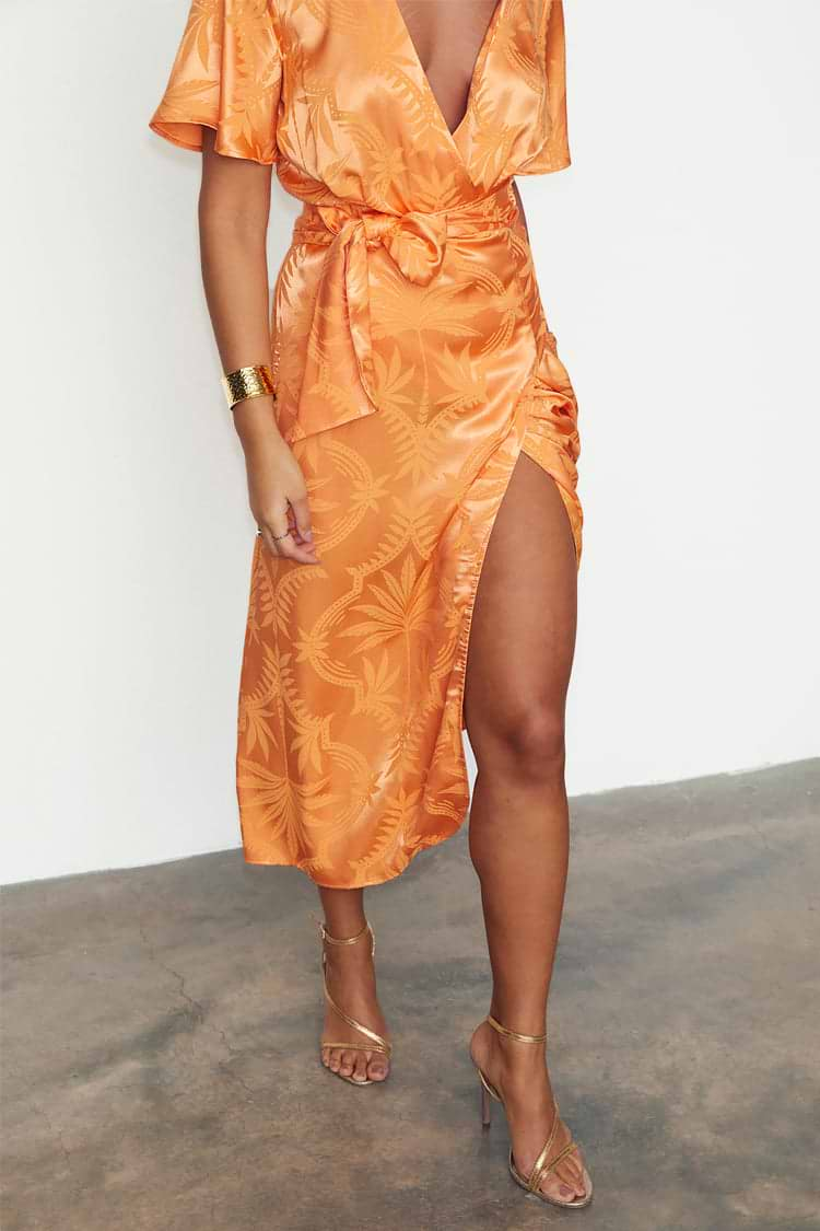 caption_Model wears Apricot Palm Vienna Dress in UK size 10/ US 6