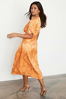 Thumbnail for caption_Model wears Apricot Palm Vienna Dress in UK size 10/ US 6