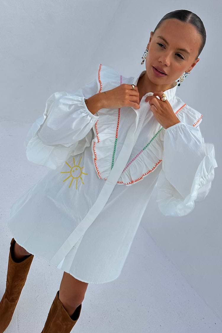 caption_Model wears White Ibiza Austin Mini Dress in UK size 8/ US 4