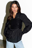 Thumbnail for Model wears Black Sequin Crop Top over black shirt