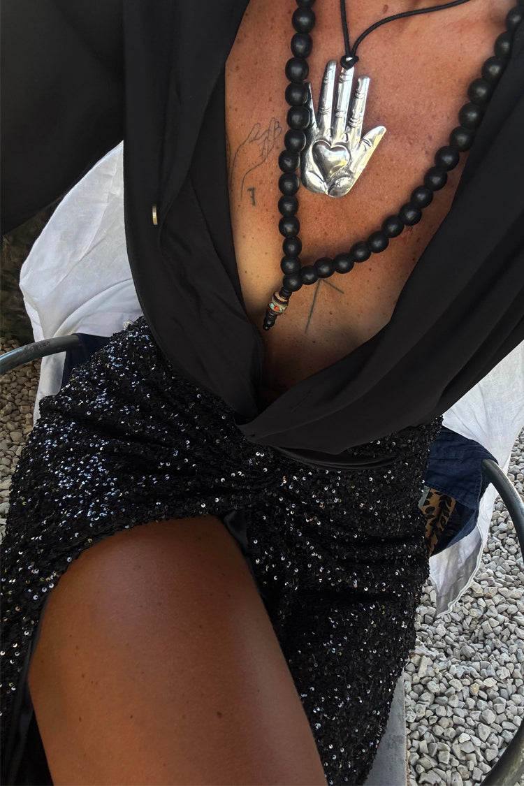 caption_Model wears Black Sequin Maxi Jaspre Wrap Skirt in UK size 10/ US 6