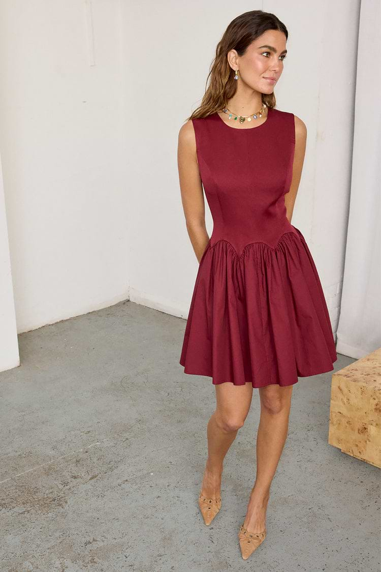 caption_Model wears Burgundy Mini Monika Dress in UK size 10/ US 6