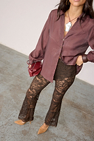 Thumbnail for caption_Model wears Chocolate Lace Diva Trousers in UK size 6/ US 2