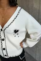 Thumbnail for caption_Model wears Cream Mystical Tattoo Cardigan in UK size 10/ US 6