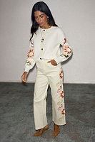 Thumbnail for caption_Model wears  Cream Enchanted Cardigan in size S