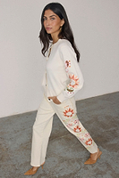 Thumbnail for caption_Model wears  Cream Enchanted Cardigan in size S