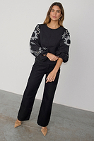 Thumbnail for caption_Model wears Black Enchanted Lillie Top in UK size 8/ US 4