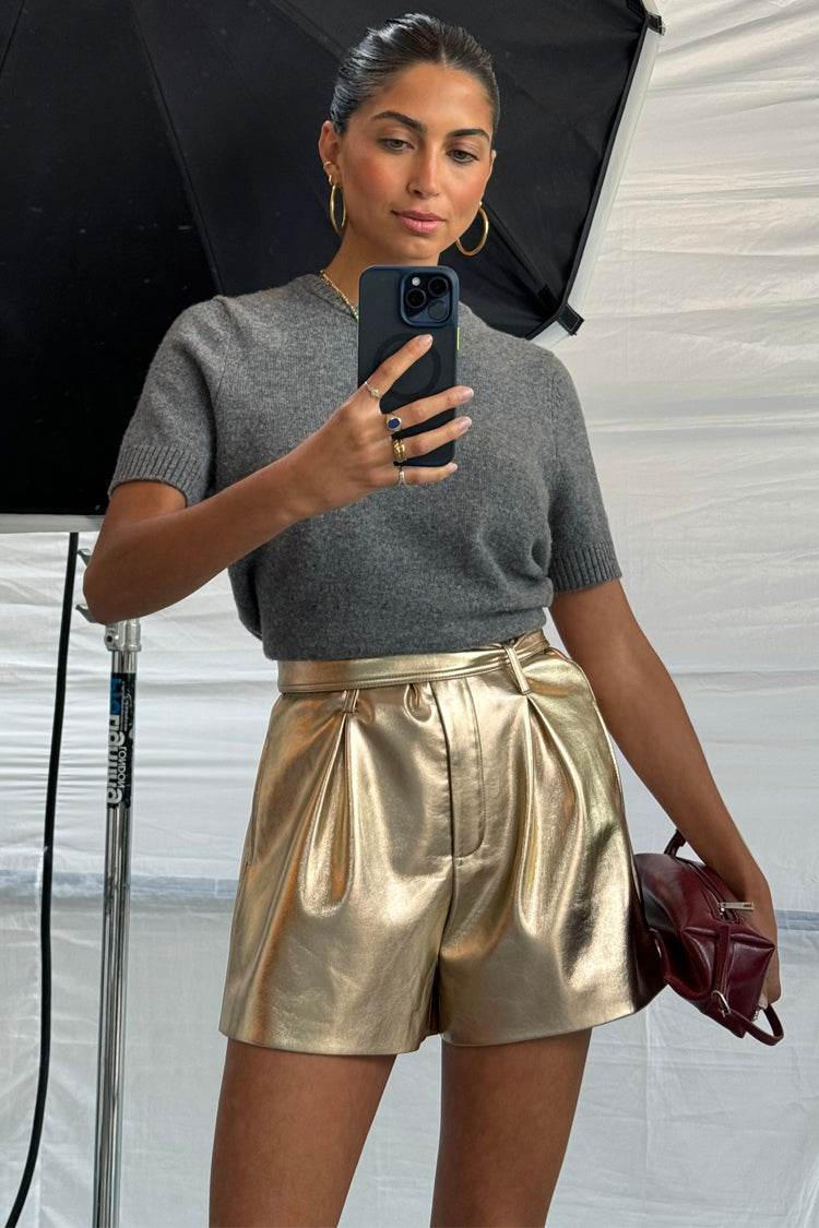 caption_Model wears Gold Vegan Leather Shorts  in UK size 8/ US 4