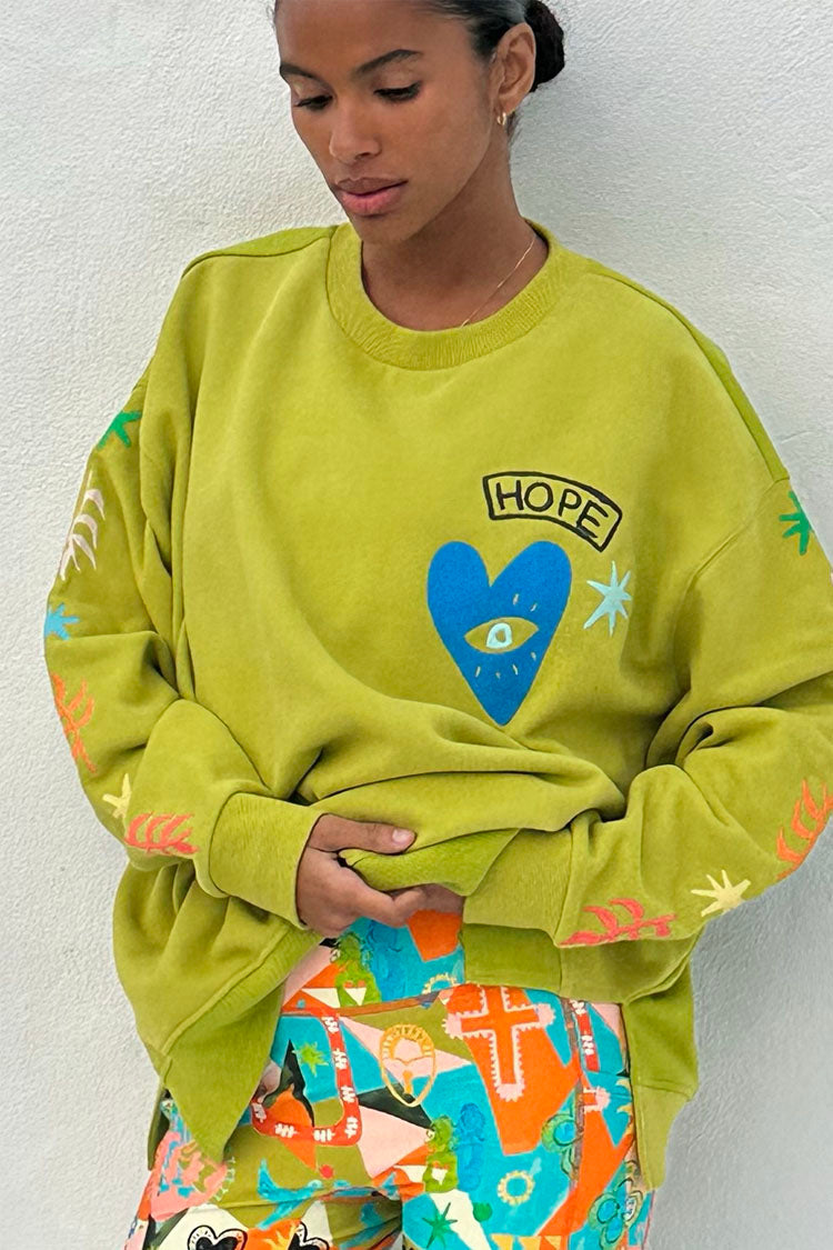 caption_Model wears Hope Green Sweater in UK size 10/ US 6