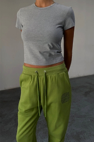 Thumbnail for caption_Model wears Olive and Charcoal NFD Joggers in size S