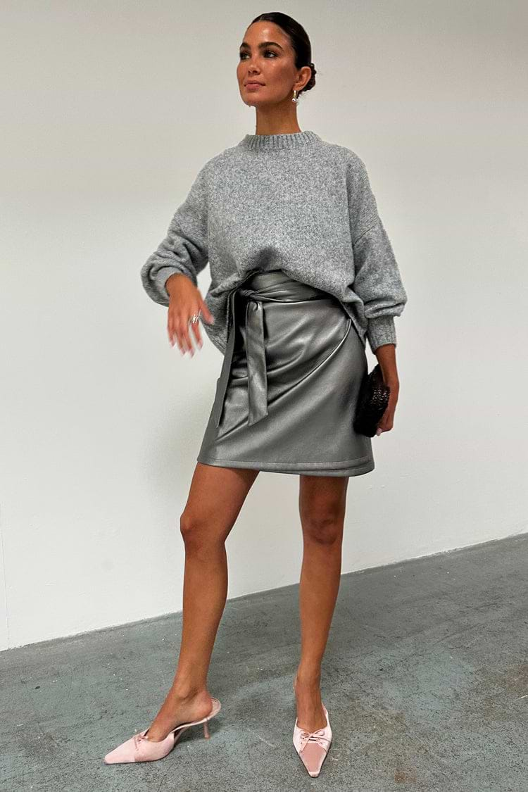 caption_Model wears Gunmetal Vegan Leather Mini Jaspre Skirt  in UK size 10/ US 6