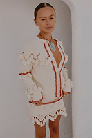 Thumbnail for caption_Model wears Ivory and Red Harper Cardigan in size S