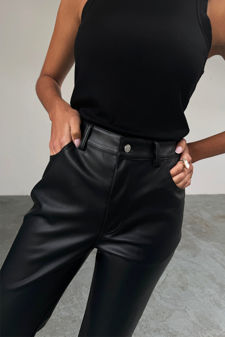 caption_Model wears Black Vegan Leather Trousers in UK size 10/ US 6