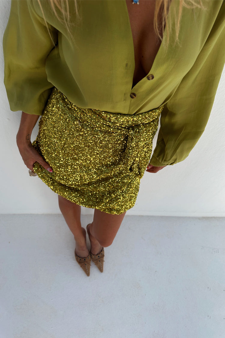 caption_Model wears Lime Sequin Mini Jaspre Skirt in UK size 10/ US 6