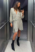 Thumbnail for caption_Model wears Silver Sequin Mini Vienna Wrap Dress  in UK size 8/ US 4