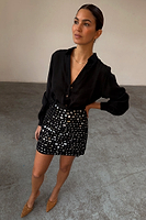 Thumbnail for caption_Model wears Black Beaded Mirror Skirt in size S