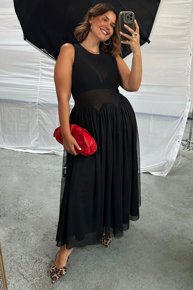 caption_Model wears Black Mesh Monika Dress in UK size 18/ US 14