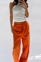 Thumbnail for caption_Model wears Orange Demi Cotton Linen Trousers in UK size 10/ US 6
