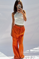 Thumbnail for caption_Model wears Orange Demi Cotton Linen Trousers in UK size 10/ US 6