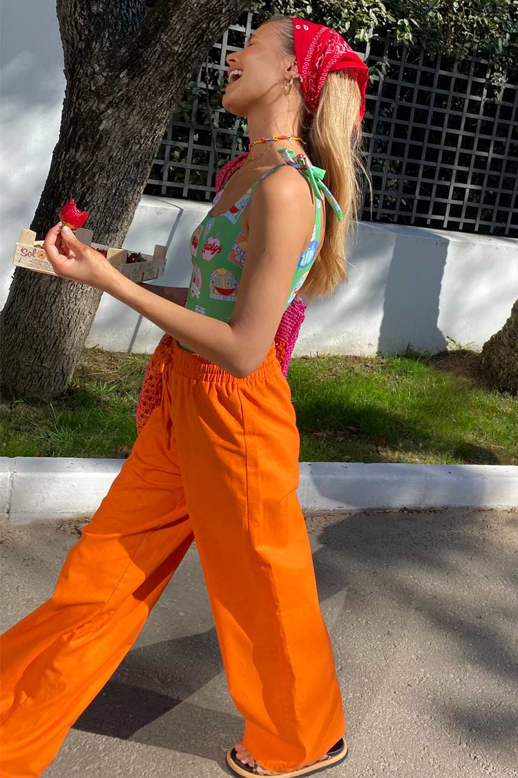 caption_Model wears Orange Demi Cotton Linen Trousers in UK size 10/ US 6