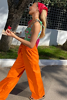 Thumbnail for caption_Model wears Orange Demi Cotton Linen Trousers in UK size 10/ US 6