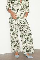 Thumbnail for caption_Model wears Green Palm Linen Rhea Trousers in UK size 10/ US 6