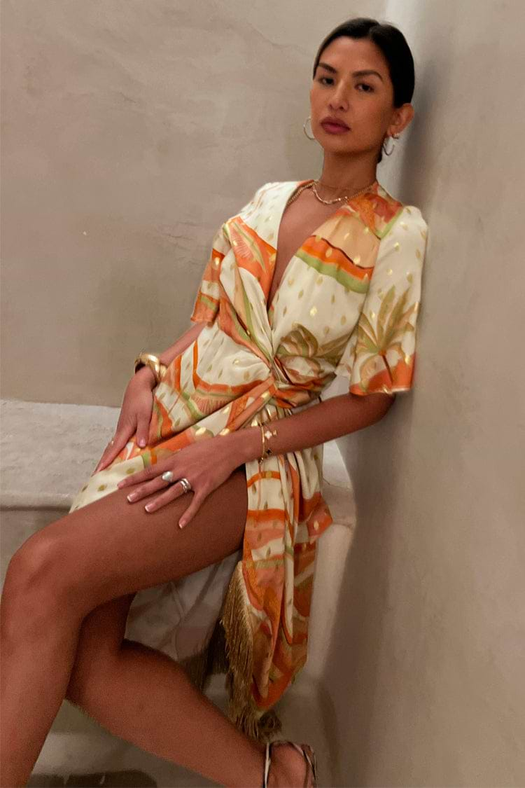 caption_Model wears Pastel Palm Ceryes Wrap Dress in UK size 10/ US 6