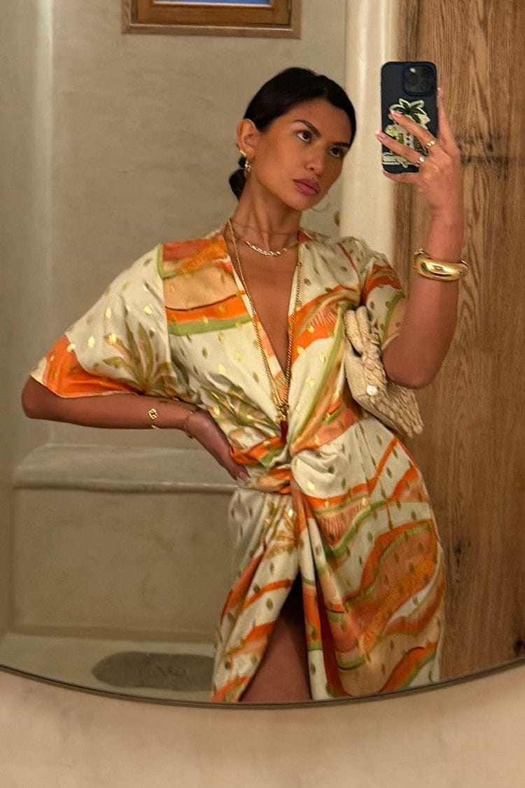 caption_Model wears Pastel Palm Ceryes Wrap Dress in UK size 10/ US 6