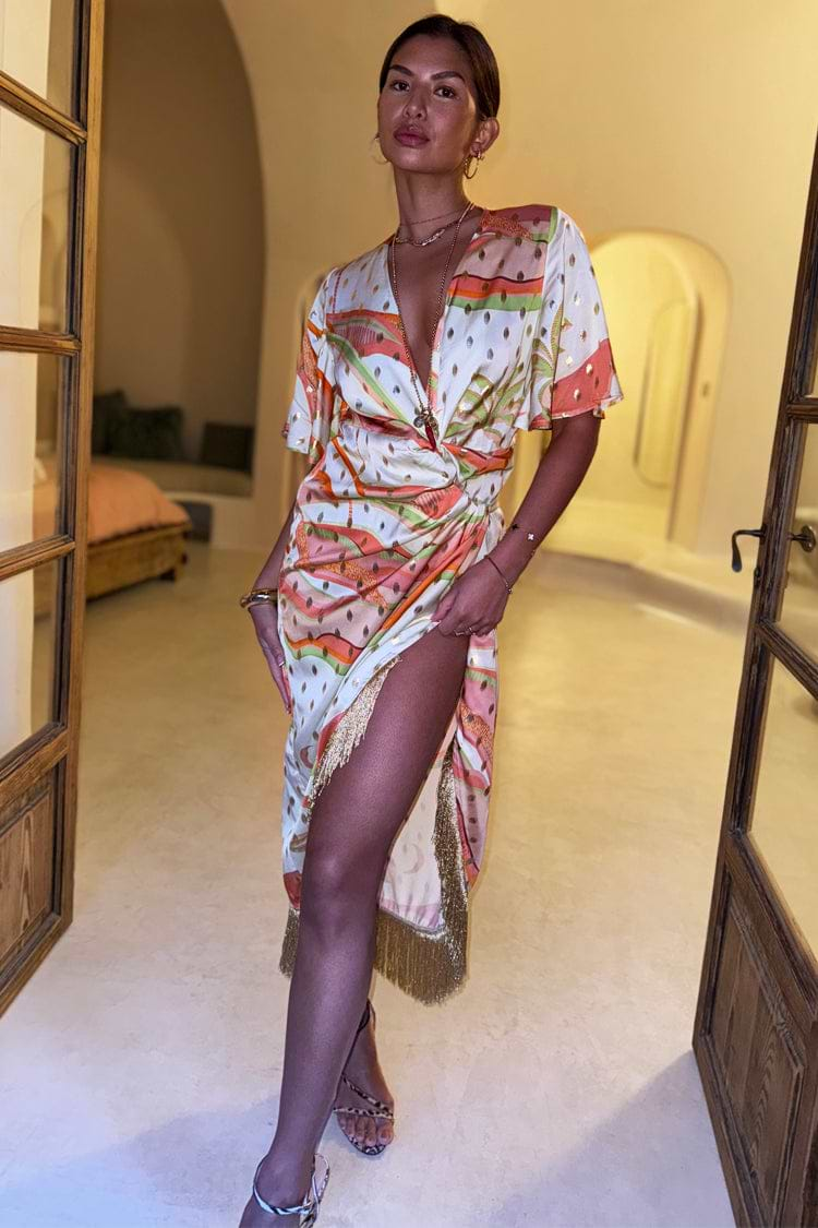 caption_Model wears Pastel Palm Ceryes Wrap Dress in UK size 10/ US 6