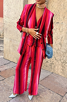 Thumbnail for caption_Model wears Pink Stripe Elisa Trousers in UK size 8/ US 4