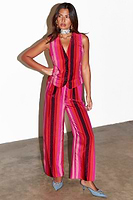 Thumbnail for caption_Model wears Pink Stripe Elisa Trousers in UK size 8/ US 4