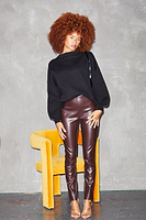 Thumbnail for Model Wearing chocolate vegan leather Ponte Leggings sitting full length standing up