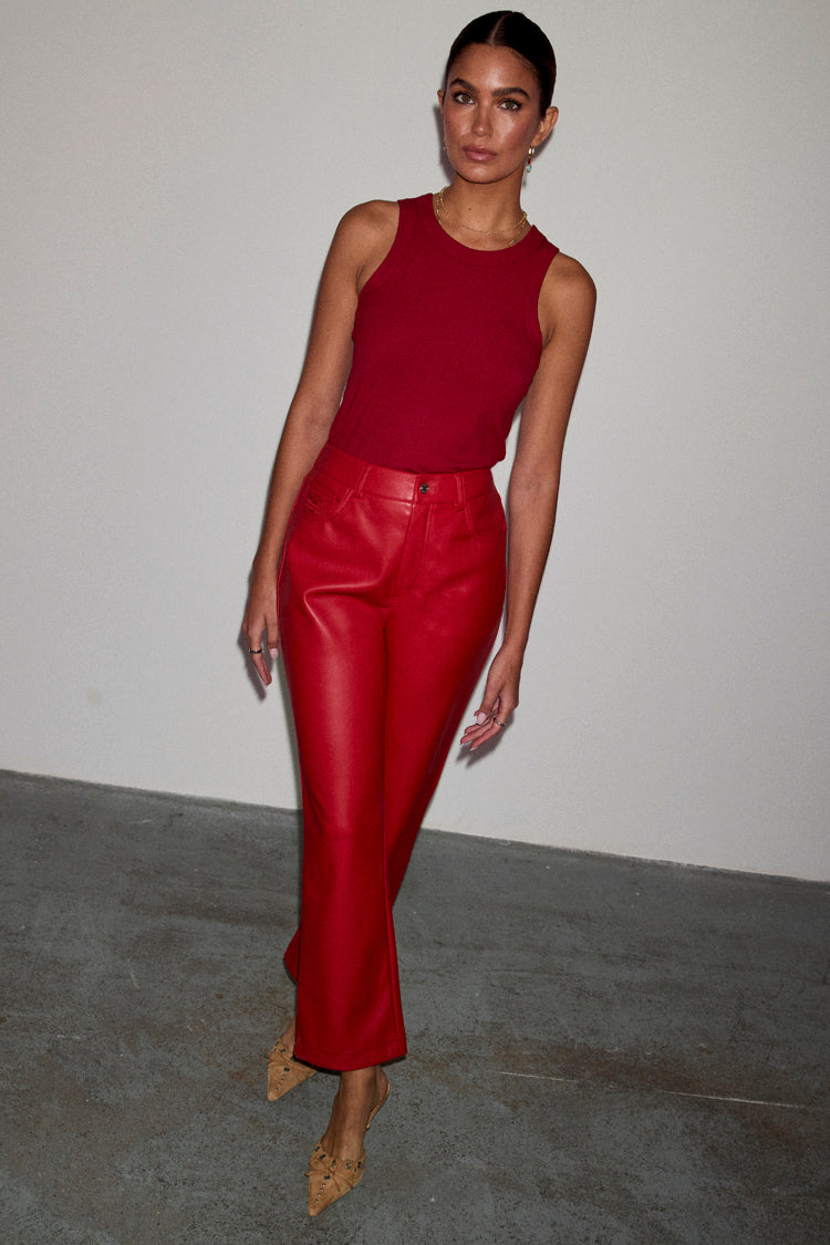 caption_Model wears Deep Red Vegan Leather Trousers in UK size 10/ US 6