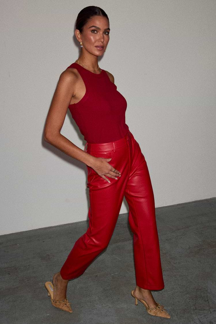 caption_Model wears Deep Red Vegan Leather Trousers in UK size 10/ US 6