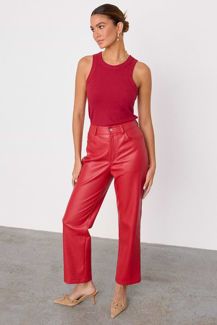 caption_Model wears Deep Red Vegan Leather Trousers in UK size 10/ US 6