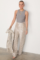 Thumbnail for caption_Model wears Silver Sequin Freddie Trousers in UK size 10/ US 6