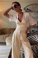 Thumbnail for caption_Model wears  Stripe Suki Trousers in UK size 6/ US 2 in petite