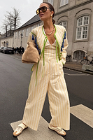 Thumbnail for caption_Model wears  Stripe Suki Trousers in UK size 6/ US 2 in petite