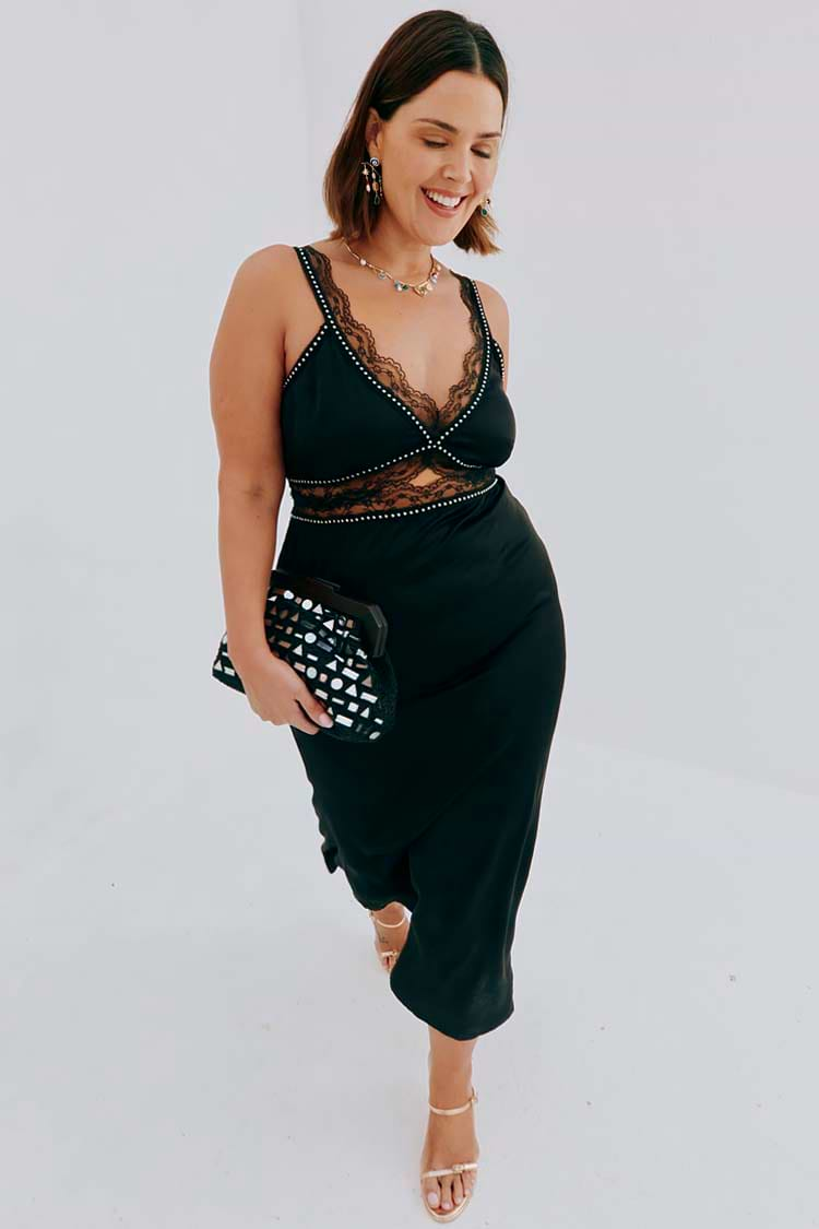 caption_Model wears Black Mimi Dress With Stud Trim in UK size 18/ US 14