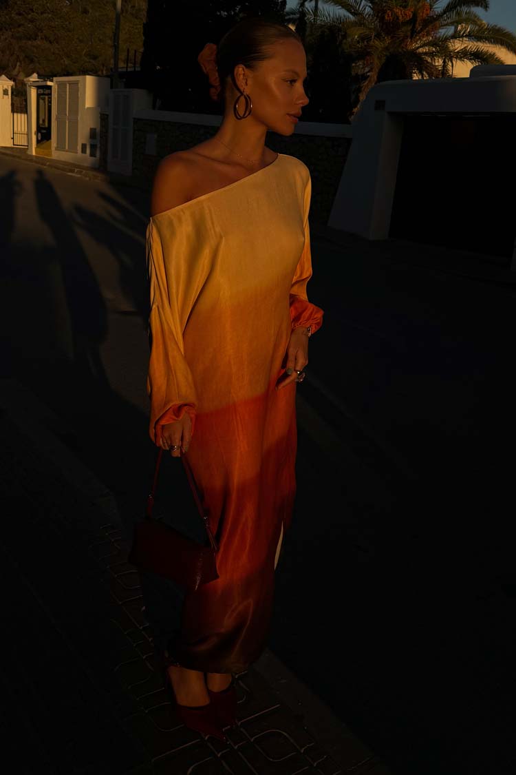 caption_Model wears Orange Sunset Jem Dress in size S/M 