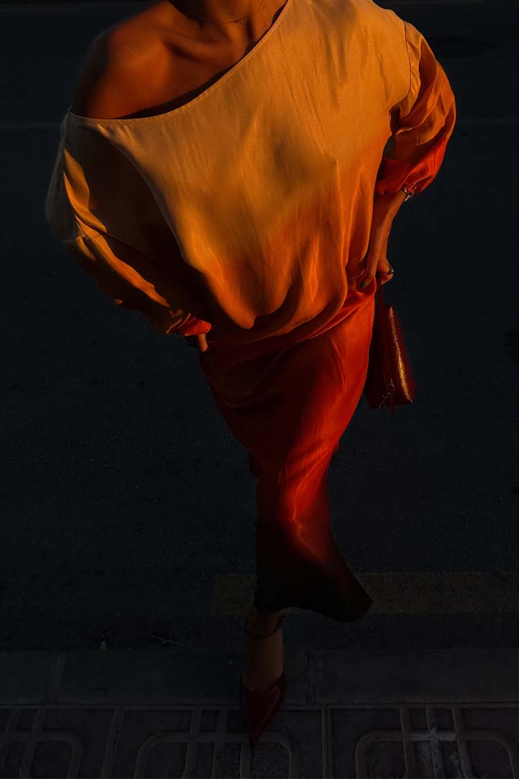 caption_Model wears Orange Sunset Jem Dress in size S/M 