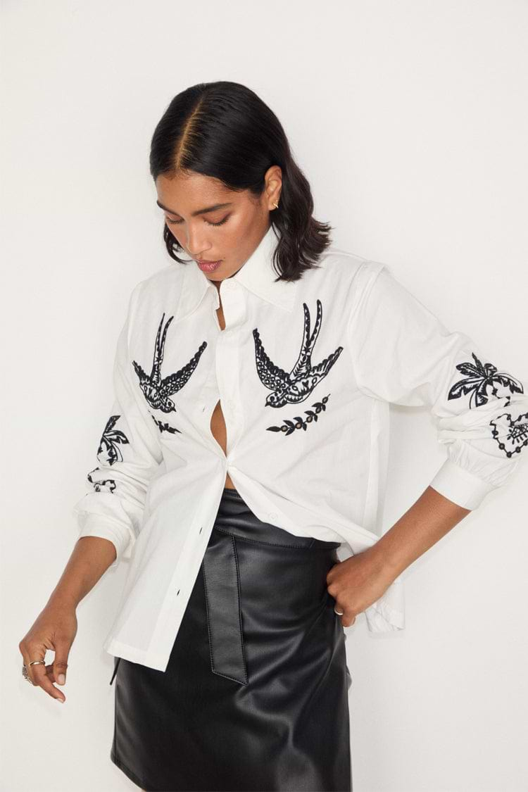 caption_Model wears White Embroidered Swallow Shirt in UK size 10/ US 6