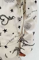 Thumbnail for caption_Model wears Cream Tattoo Button Through Pyjamas in UK size 18/ US 14