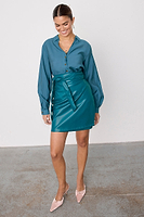 Thumbnail for caption_Model wears Teal Vegan Leather Mini Jaspre Skirt in UK size 10/ US 6