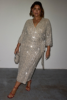 Thumbnail for caption_Model wears Silver Sequin Kira Wrap Dress in UK size 18/ US 14